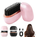 Mini cordless hair straightener brush in pink and black, front view